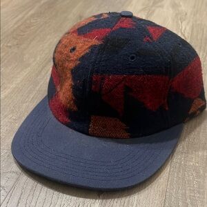 HUF 6-panel plaid strap back with leather strap.